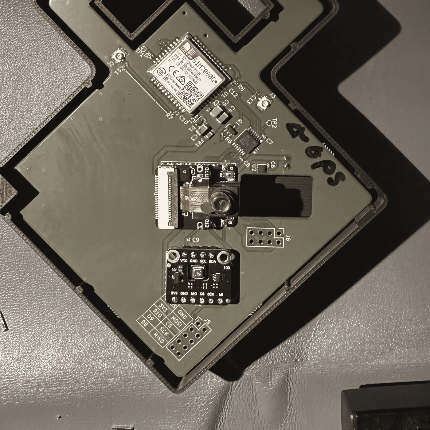 Inside the Wendy Tag prototype: circuit board with camera, cellular module, and sensor